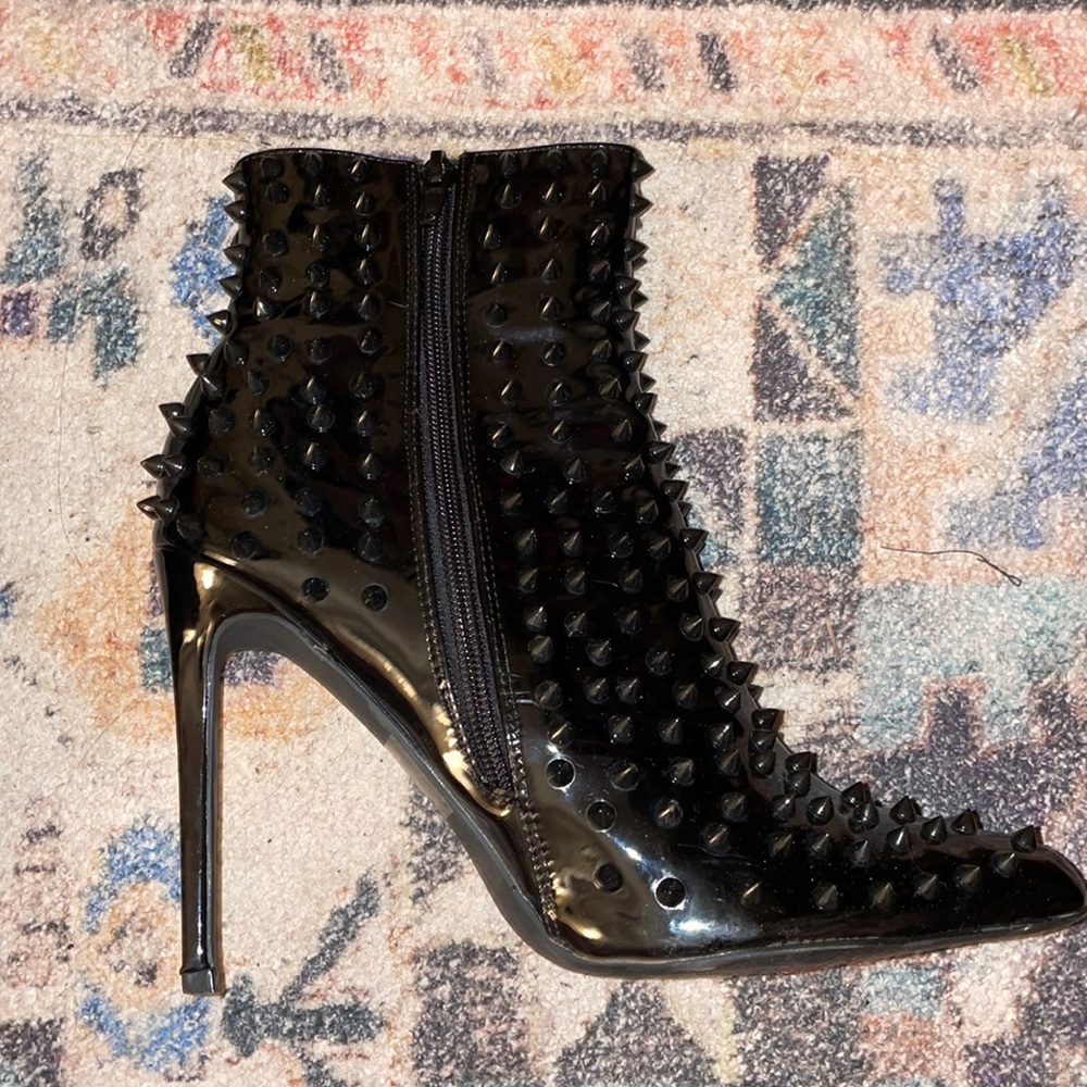 Pleather boots with pointy studs black high heels slightly worn. Comes with box